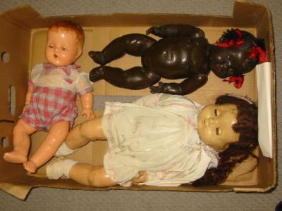 Appraisal: A Topsy black composition doll with brown sleeping eyes high