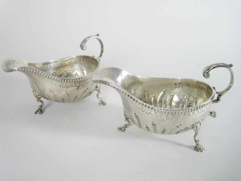 Appraisal: Pair of George II Sauce Boats gadroon embossed with beaded