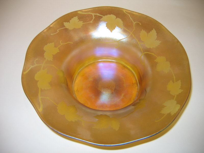 Appraisal: TIFFANY FAVRILE Gold iridescent glass bowl with etched leaf design