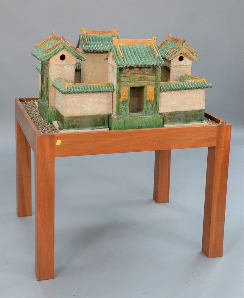 Appraisal: Chinese Model of a Village green and amber glazed pottery