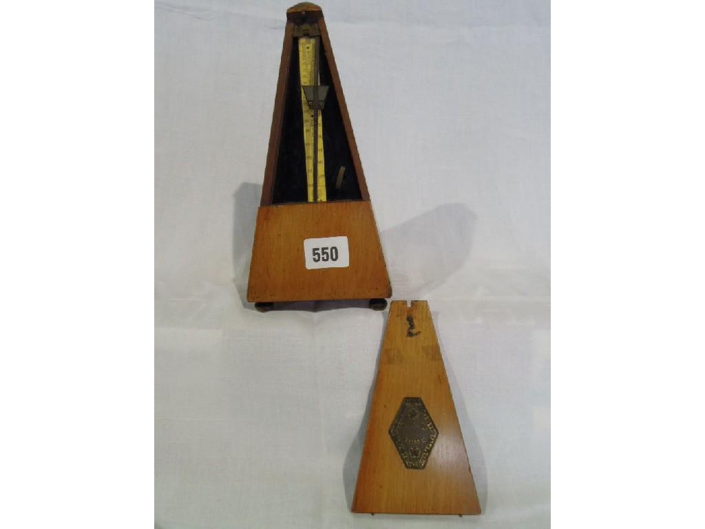 Appraisal: A Metronome in a wooden obelisk shaped case made by