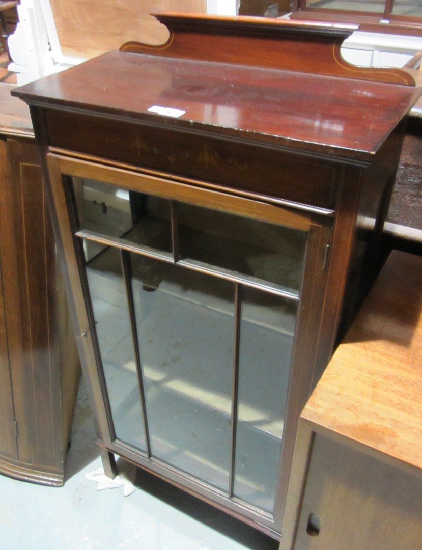 Appraisal: A th century mahogany and inlaid glazed cabinet