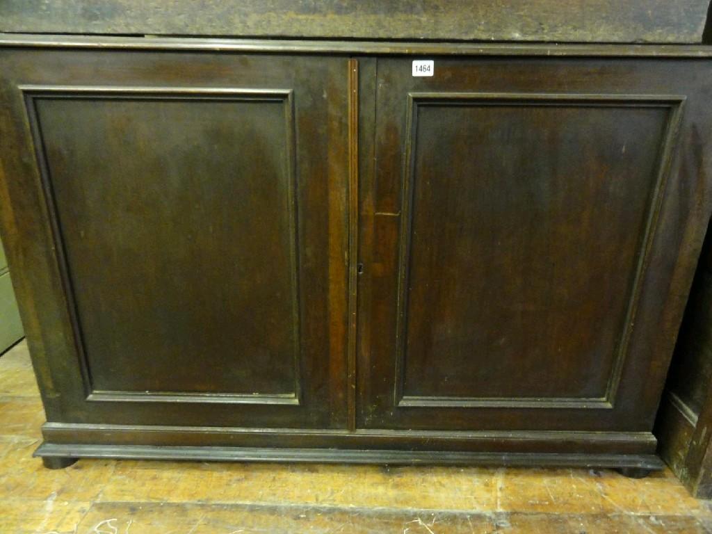 Appraisal: A th century mahogany collectors cabinet enclosed by a pair