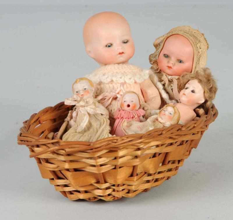 Appraisal: Lot of Small Bisque Babies in Basket Description Bisque head