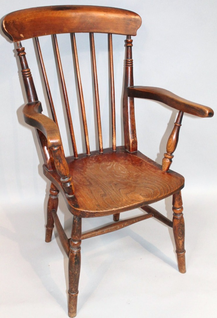 Appraisal: A thC ash and elm grandfather chair with an overhanging