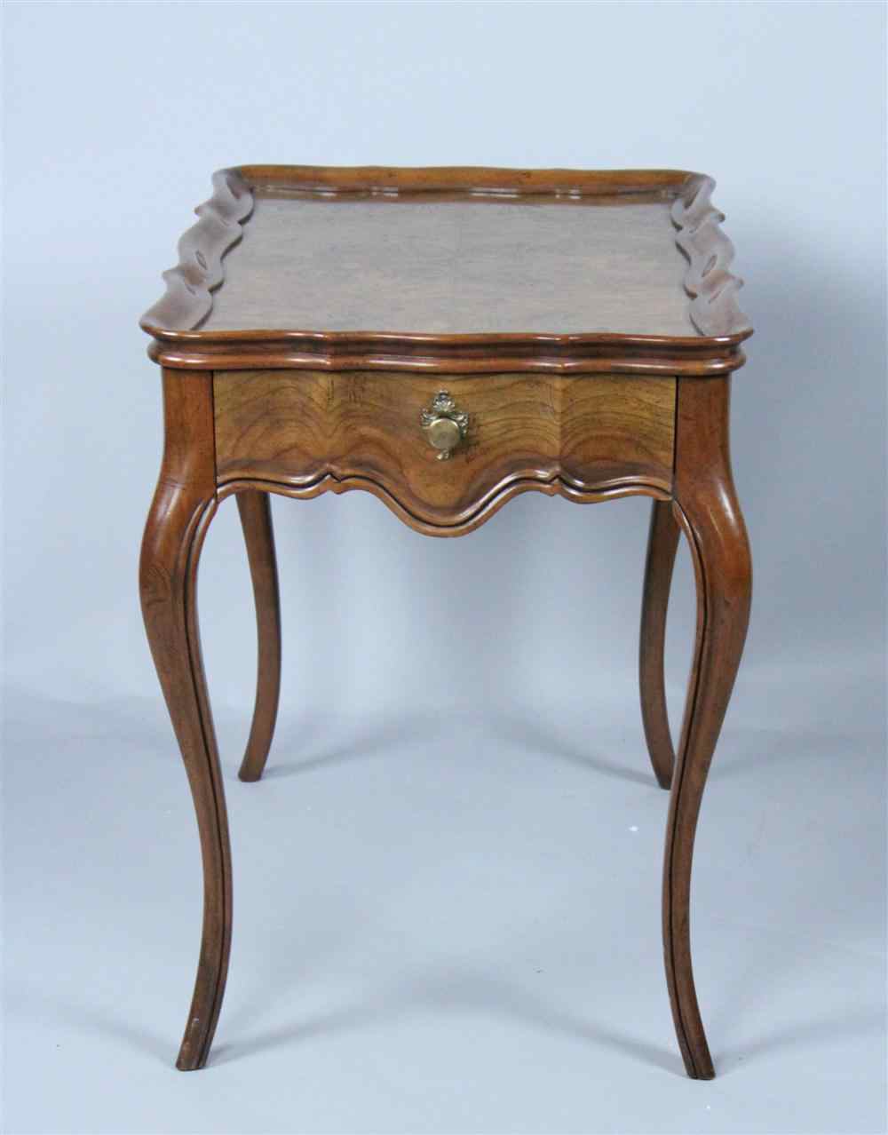 Appraisal: BAKER FRENCH STYLE WALNUT TEA TABLE WITH MOLDED EDGE of