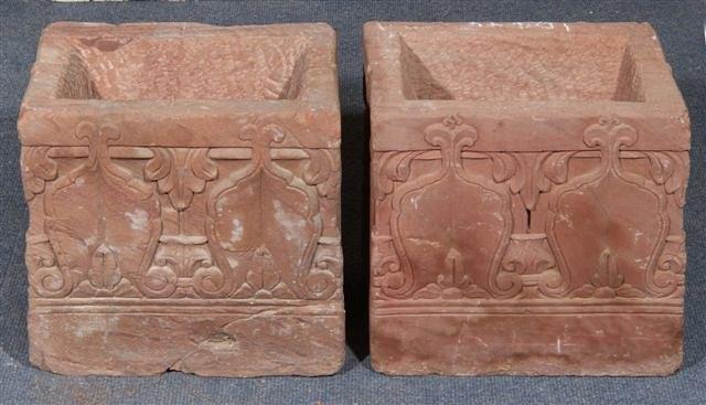 Appraisal: A PAIR OF INDIAN CARVED RED SANDSTONE PLANTERS with stylised