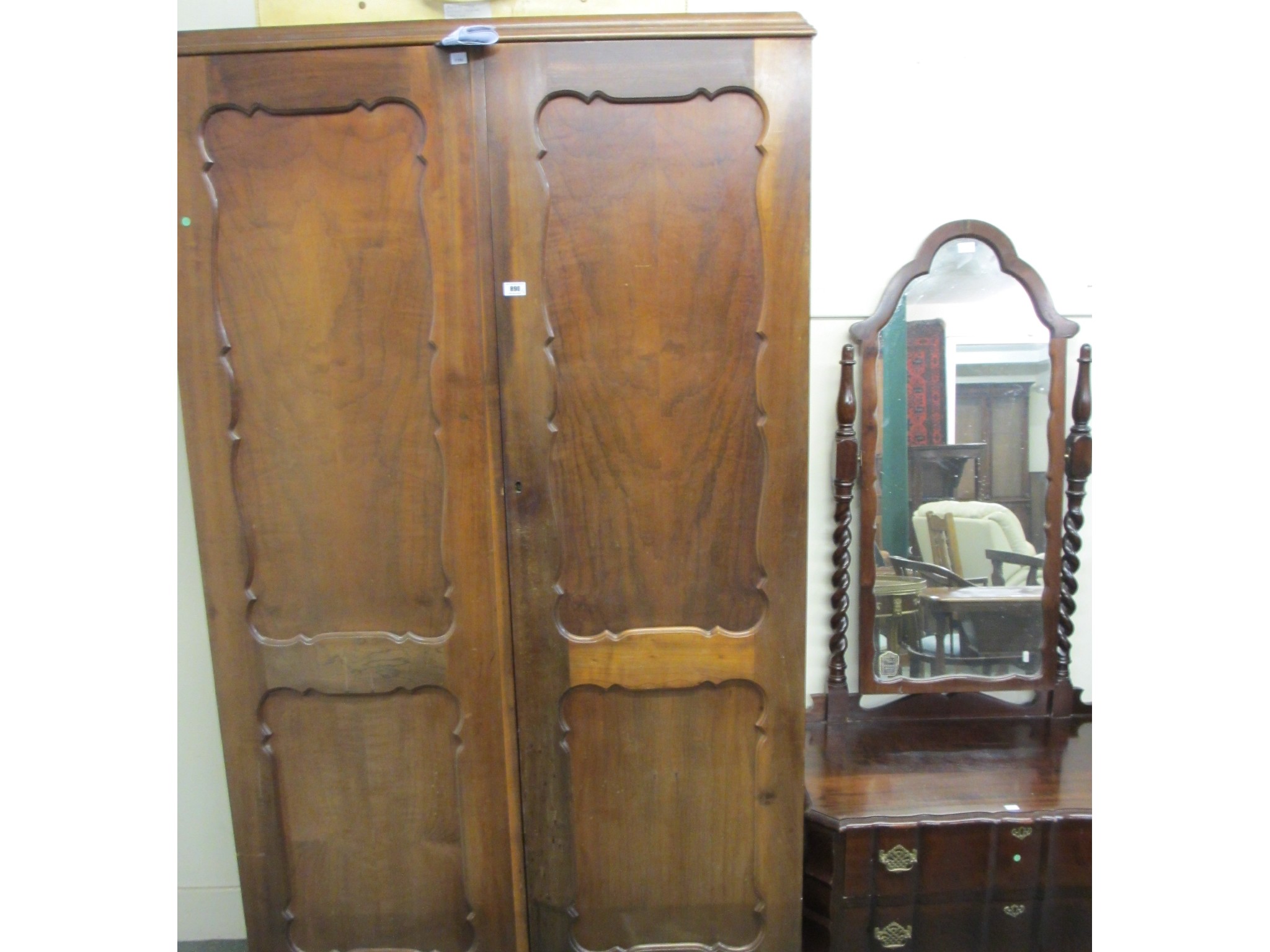 Appraisal: A walnut two door wardrobe and dressing table