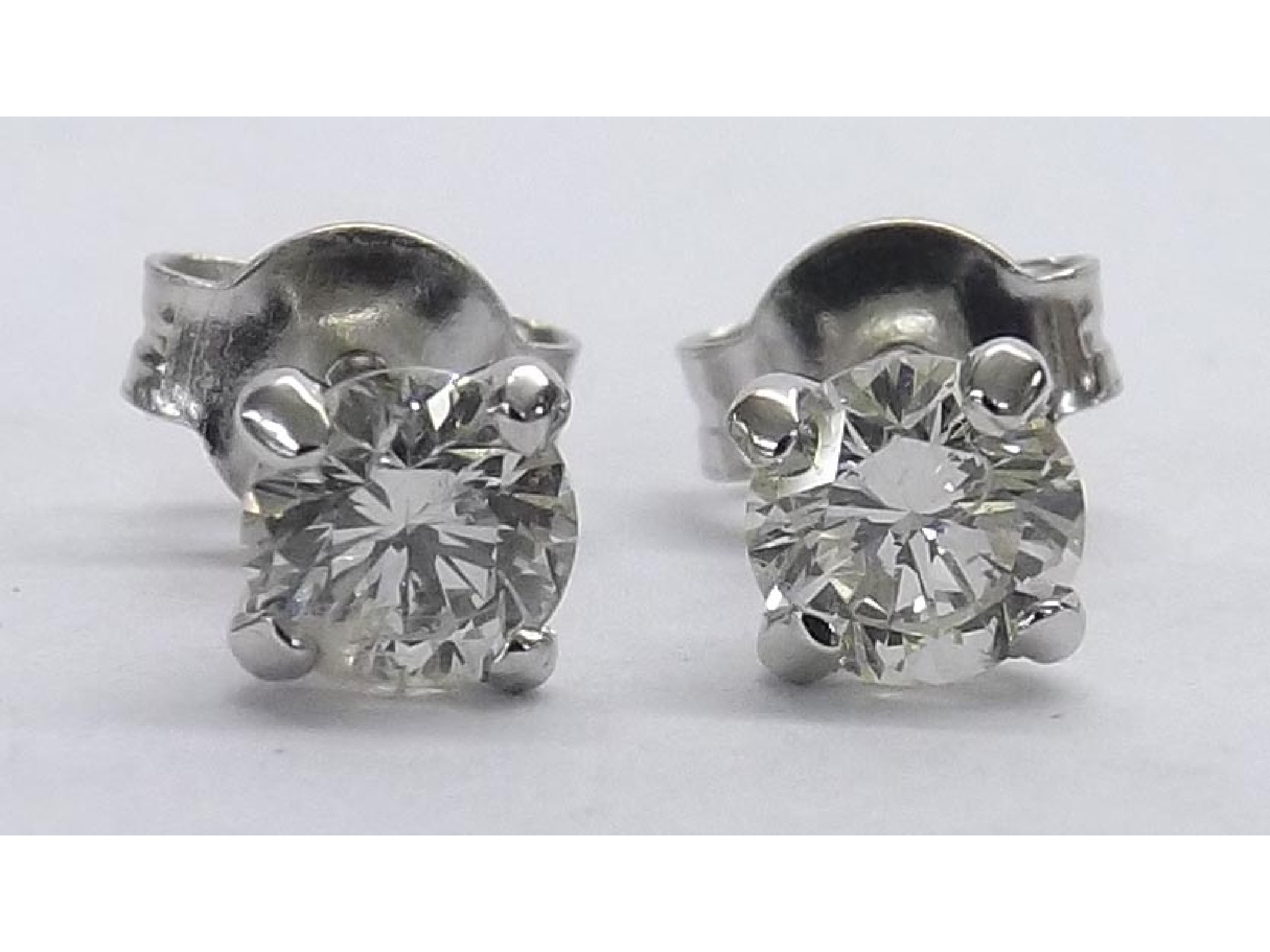 Appraisal: Pair of k white gold diamond ear studs round brilliant-cuts