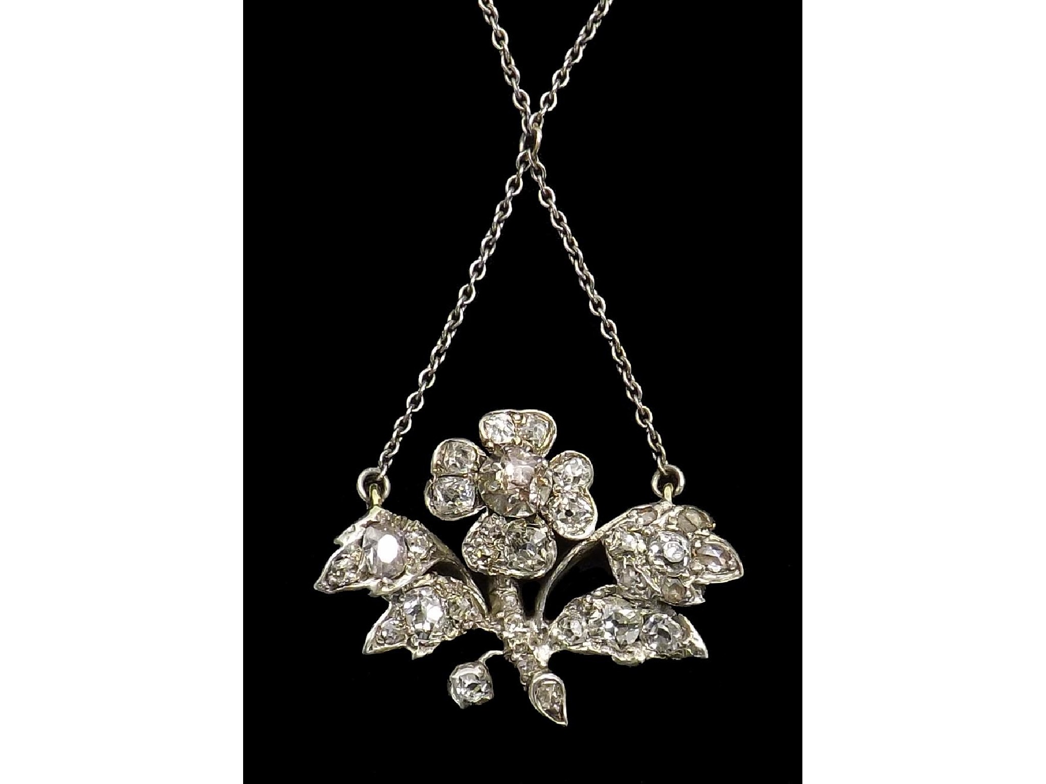 Appraisal: Diamond set floral necklet with integral pendant set with old-cut