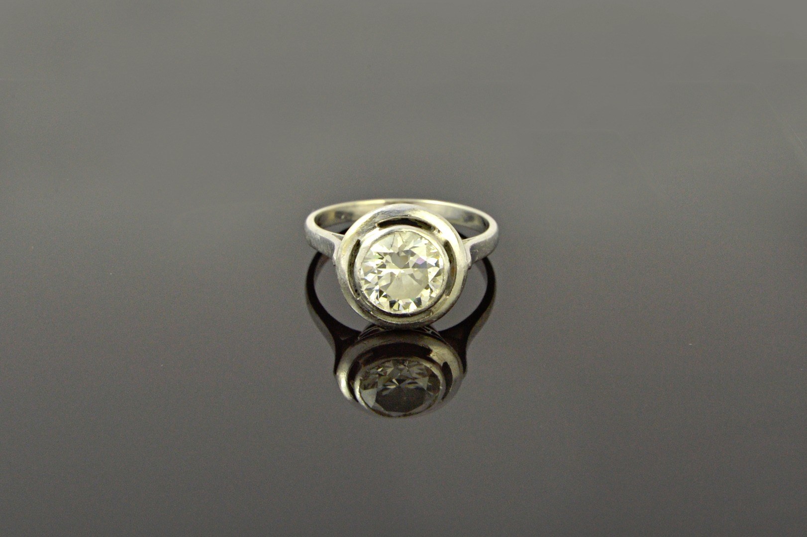 Appraisal: A diamond set single stone ring collet set with a