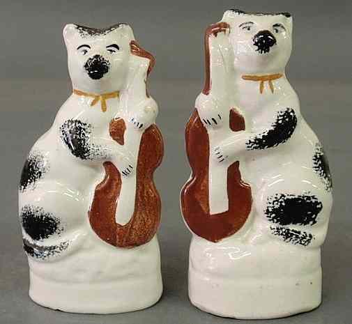 Appraisal: Small pair of th c Staffordshire seated cats playing string