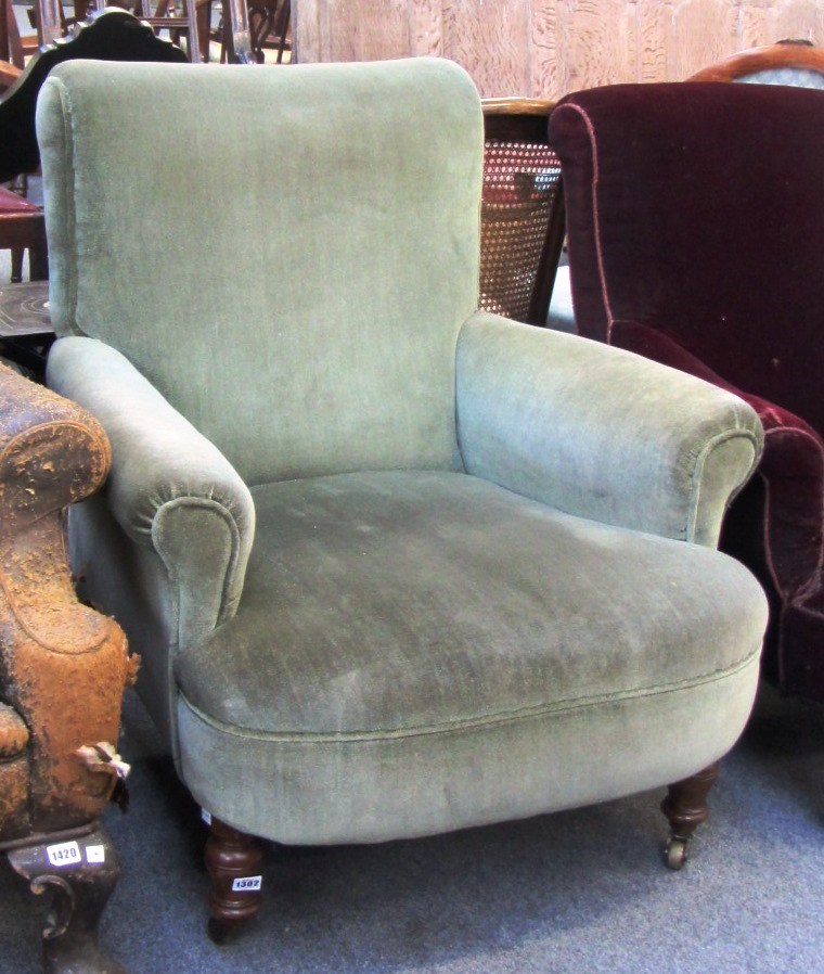 Appraisal: A th century easy armchair on turned oak supports