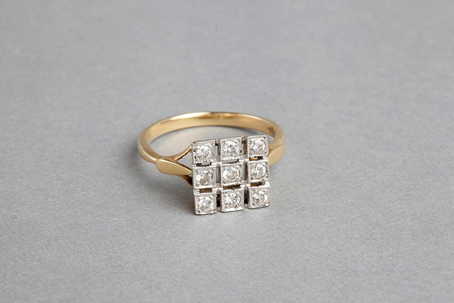 Appraisal: A DIAMOND SET DRESS RING nine diamonds mounted in an