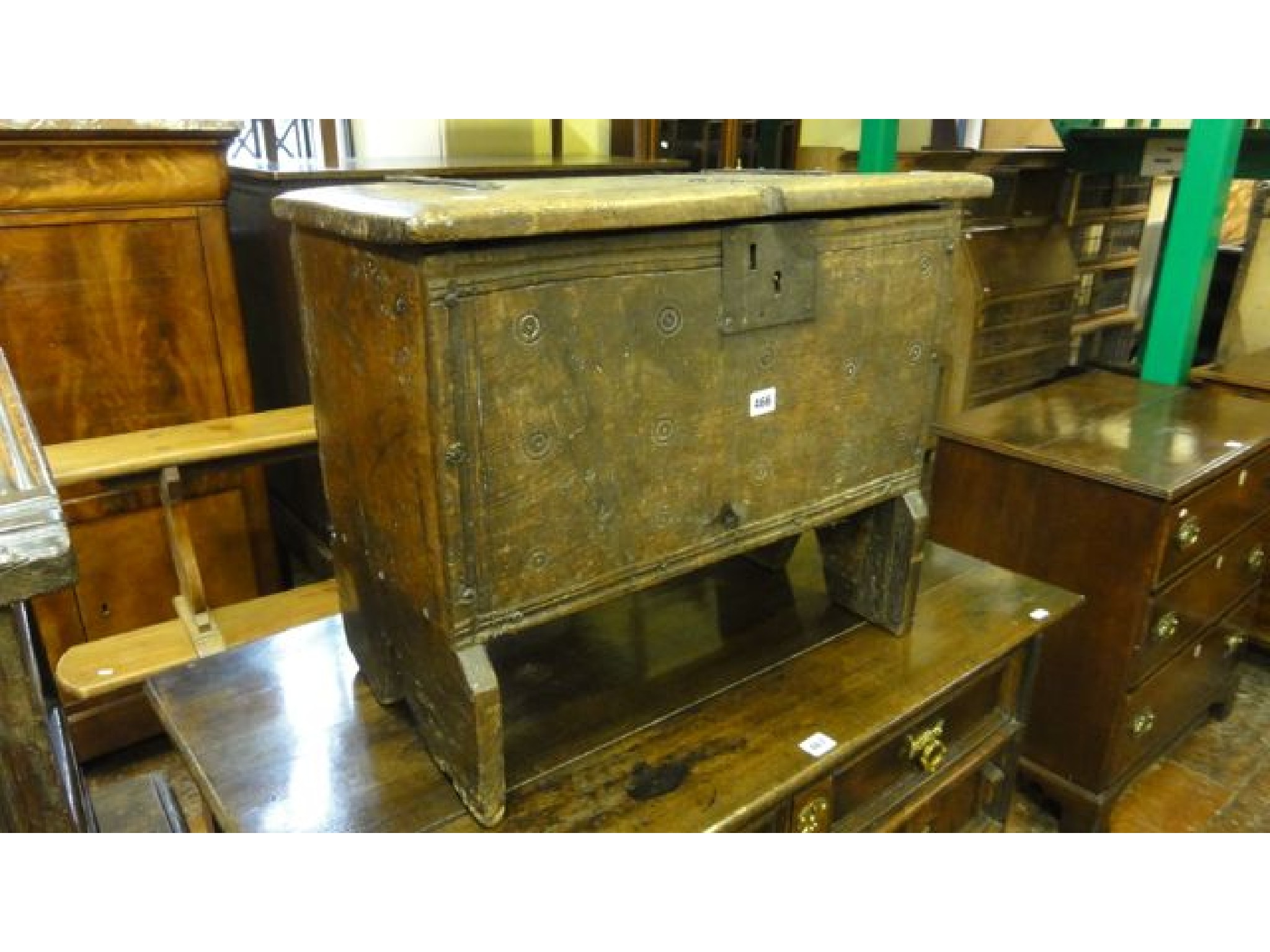 Appraisal: A primitive oak coffer of small dimensions with simple stamped