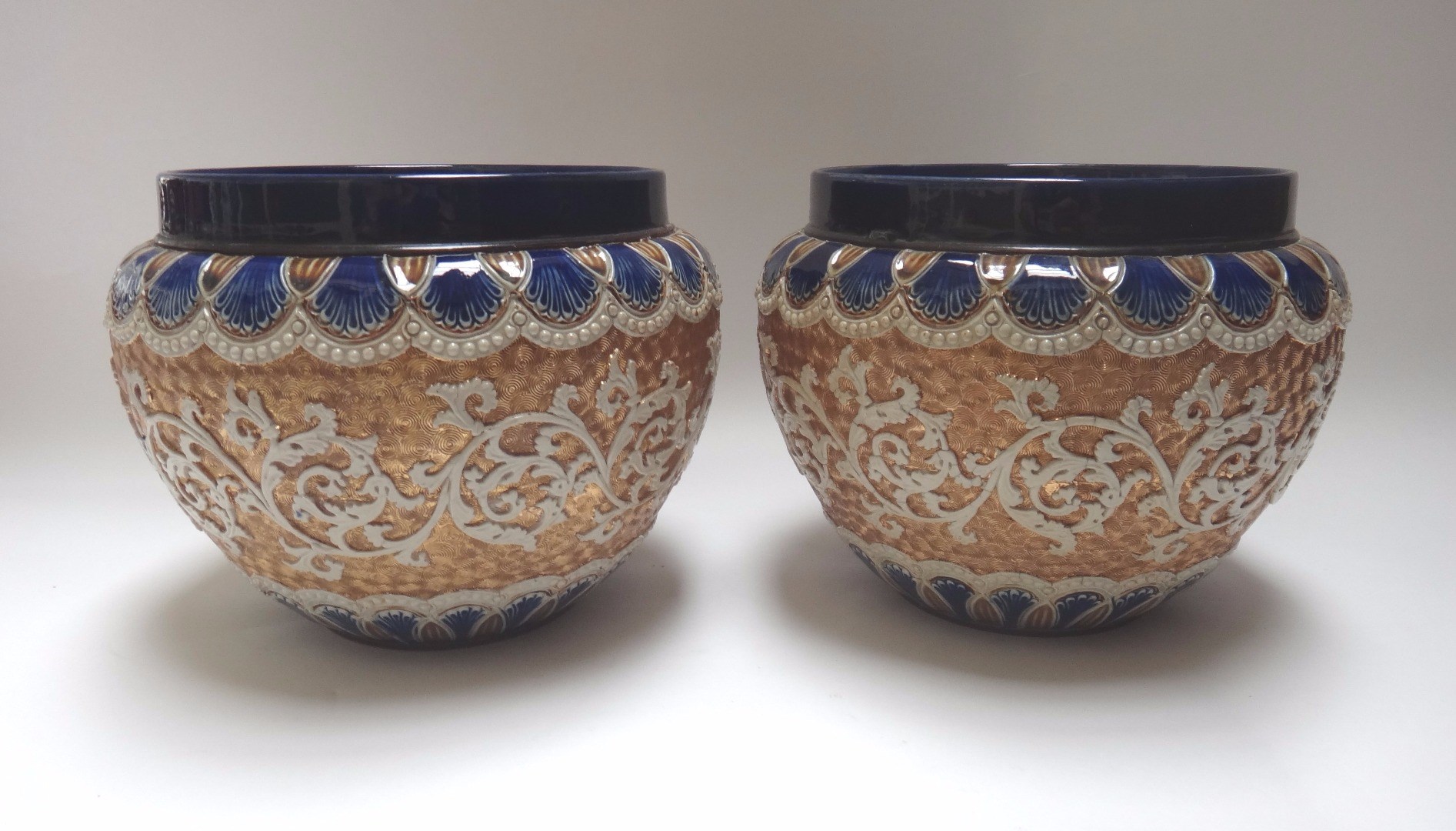 Appraisal: A pair of Royal Doulton stoneware jardini res early th