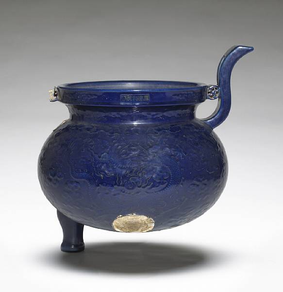 Appraisal: A massive blue glazed porcelain tripod censer Qianlong Mark and