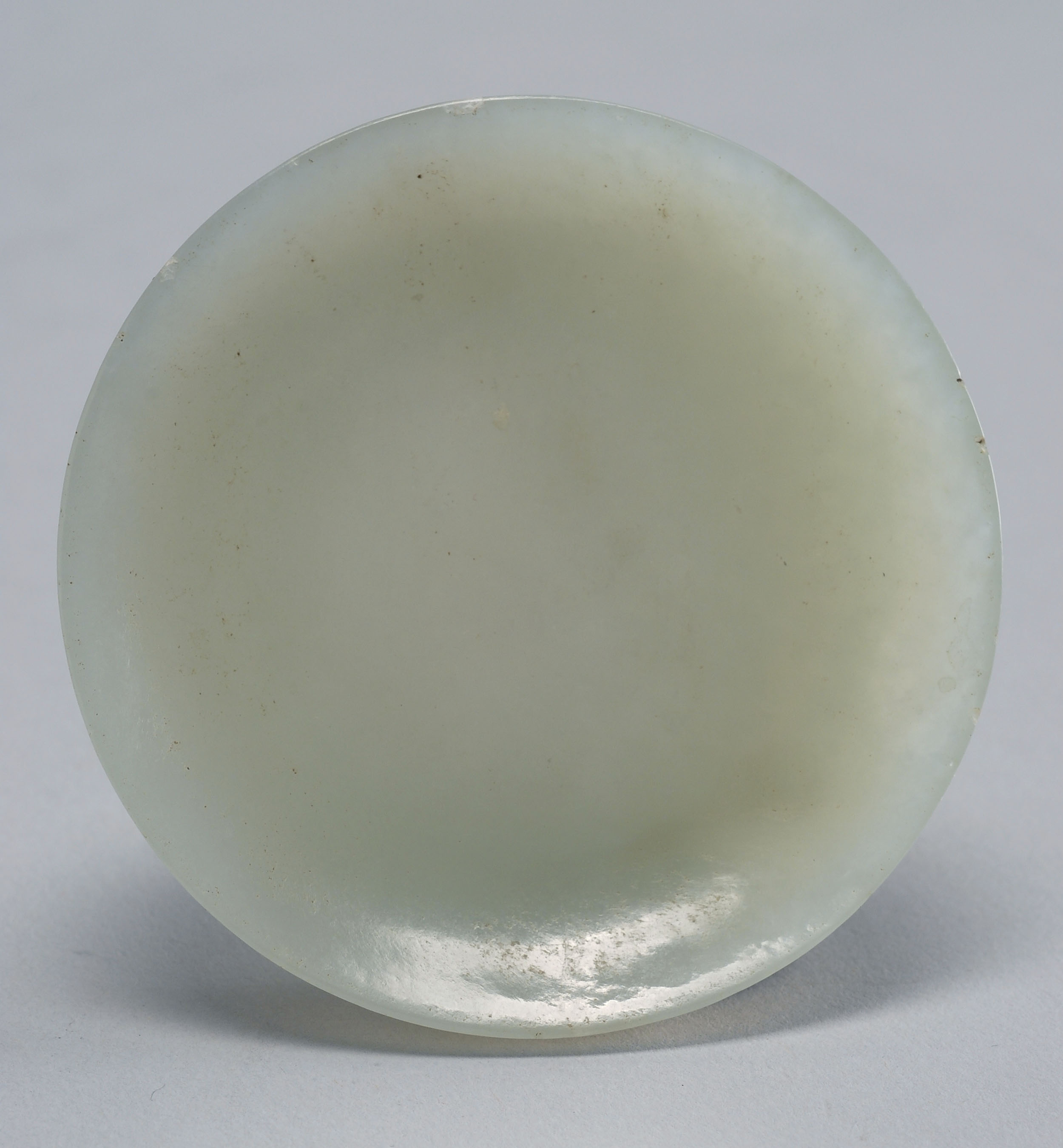 Appraisal: CELADON JADE SNUFF SAUCER Late th CenturyWith raised footring Diameter