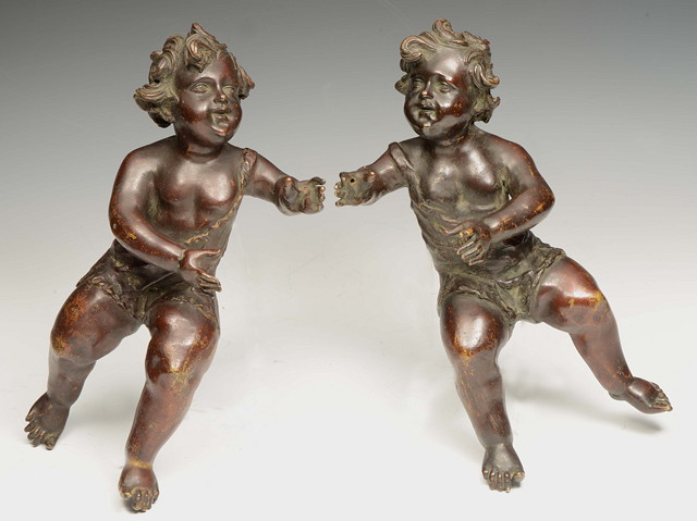 Appraisal: A PAIR OF ITALIAN BRONZE CUPIDS designed to suspend each