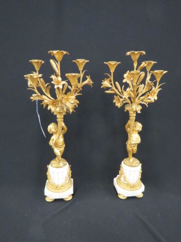 Appraisal: Pair of French Bronze Figural Candleabra putti holding up cornucopia