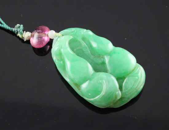 Appraisal: A Chinese jade pendant carved with gourds in Estimate -