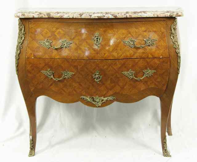 Appraisal: A Louis XV style serpentine commode the pink marble top