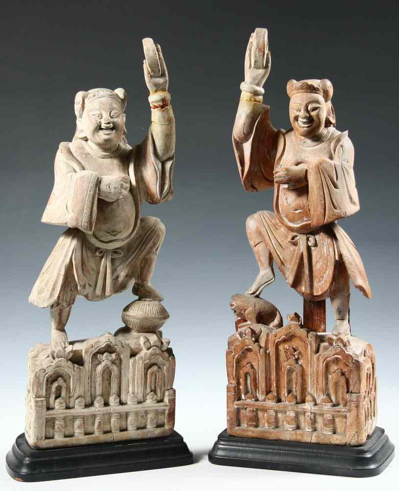 Appraisal: PAIR CHINESE WOODEN CARVINGS - Early Figures of Men Dancing