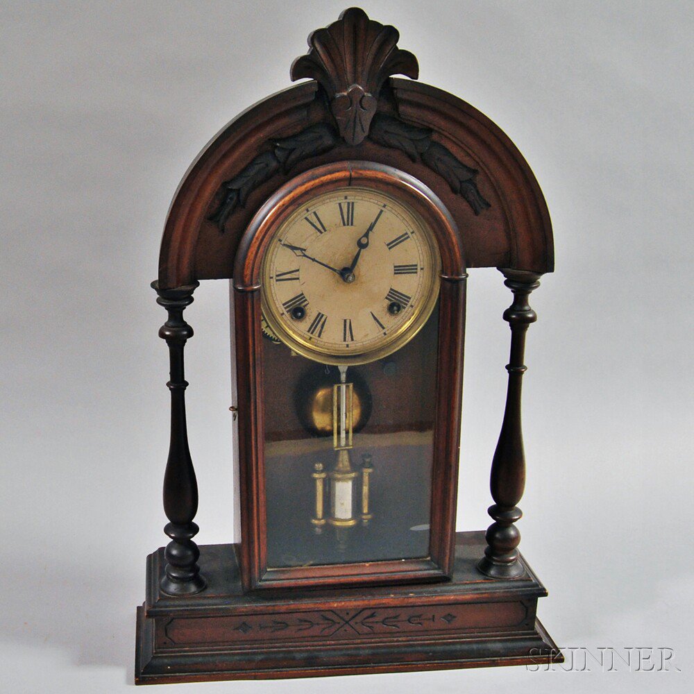 Appraisal: Carved Walnut Mantel Clock America th century the arched pediment