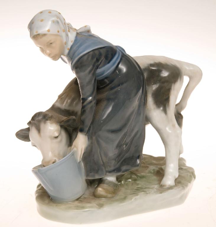 Appraisal: ROYAL COPENHAGEN MODEL OF A GIRL WITH A CALF she