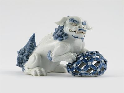 Appraisal: A Japanese Hirado model of a Buddhistic lion dog holding