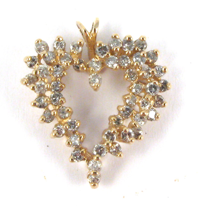 Appraisal: DIAMOND AND YELLOW GOLD HEART PENDANT k gold set with