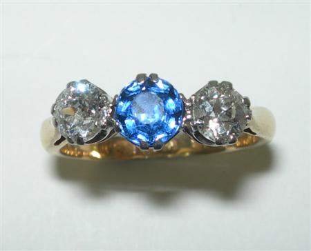 Appraisal: A late Victorian three-stone ring the central claw set circular