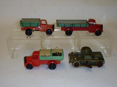 Appraisal: Three Wells Brimtoy clockwork Bedford trucks tinplate and plastic construction