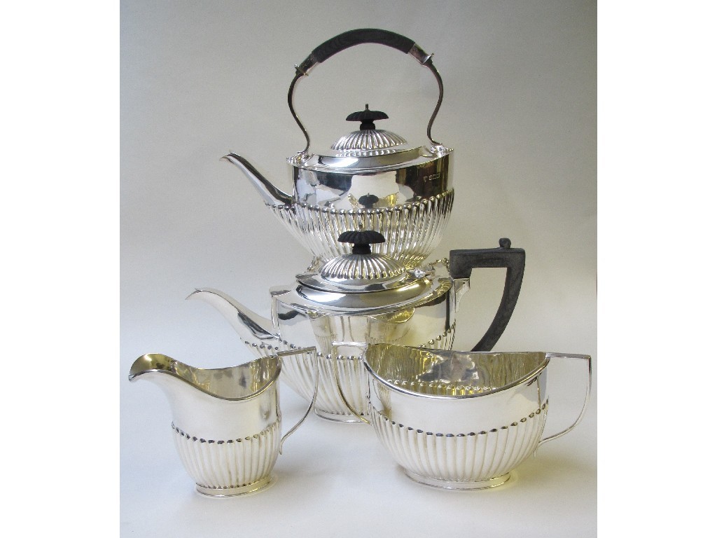 Appraisal: An Edwardian silver four piece tea service embossed with lobed