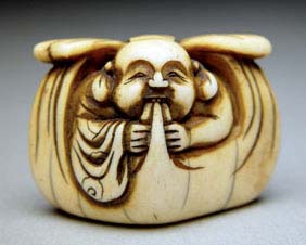 Appraisal: ANTIQUE IVORY NETSUKE Amusing and antique carved ivory netsuke of