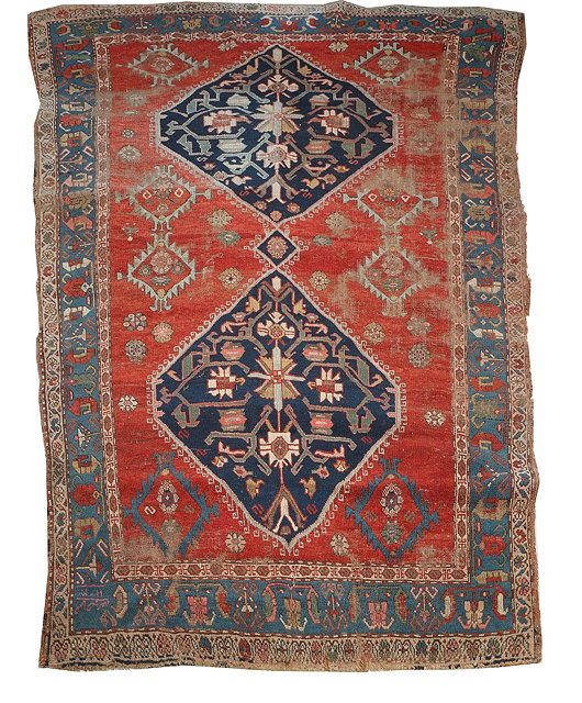 Appraisal: A NORTH WEST PERSIAN SMALL CARPET with two blue ground