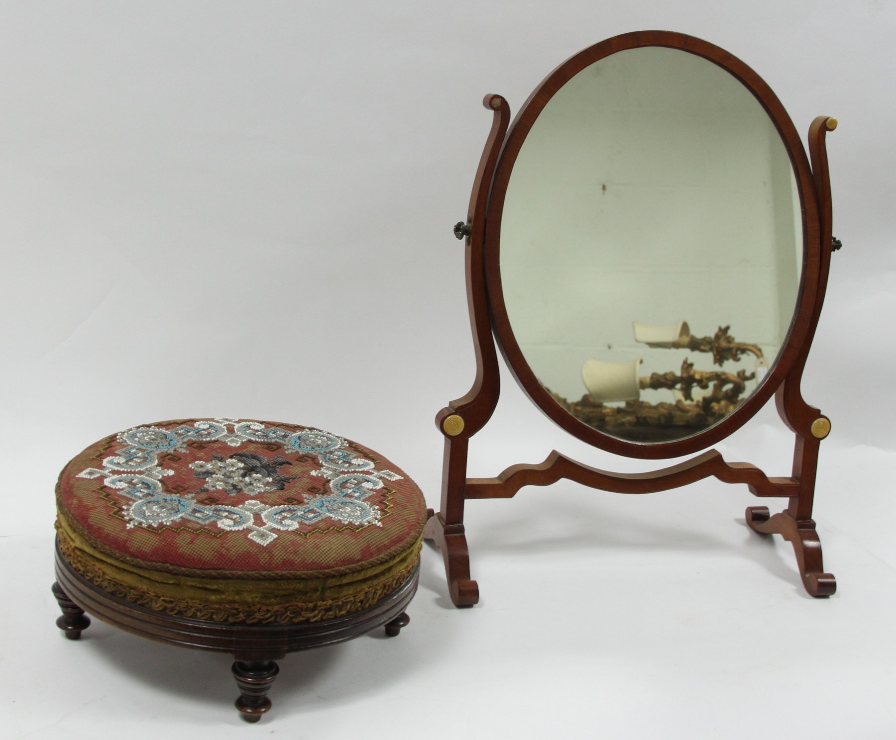 Appraisal: A Victorian mahogany and swing frame toilet mirror on splay