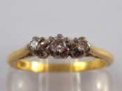 Appraisal: An carat gold three stone diamond ring size N gms