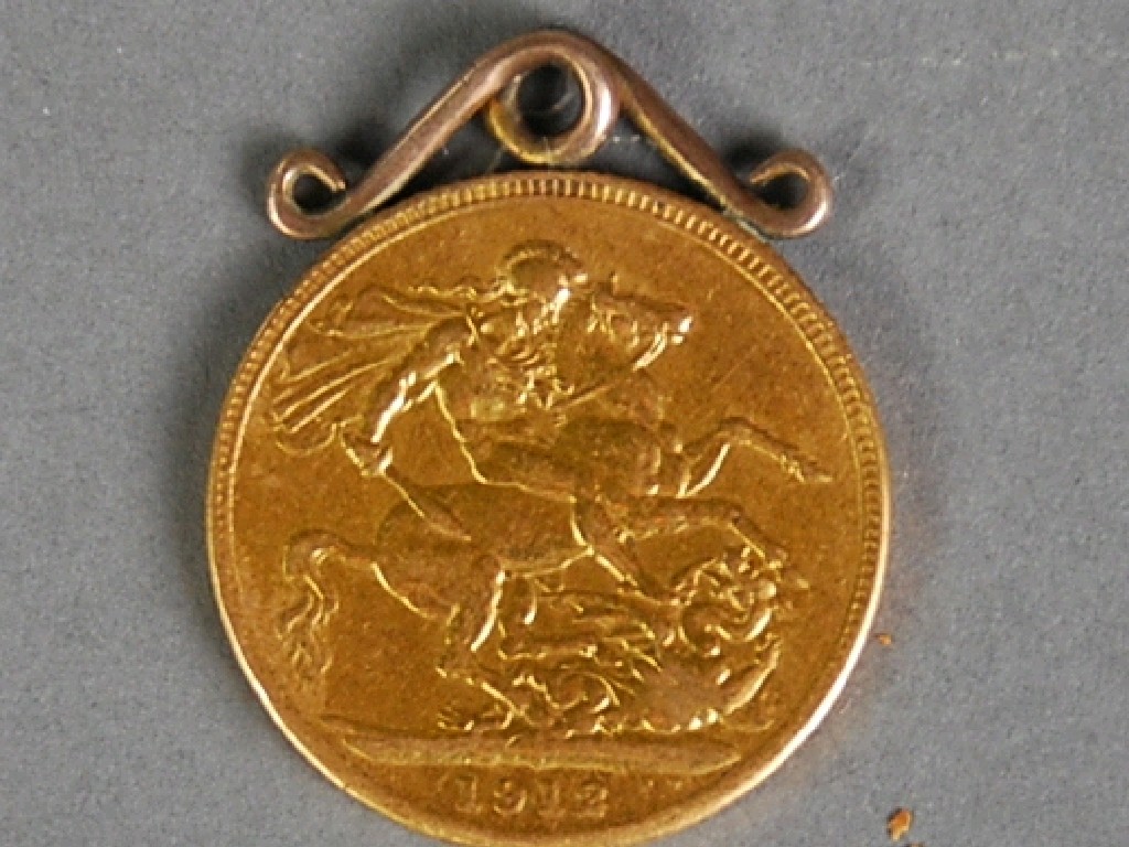 Appraisal: GEORGE V GOLD SOVEREIGN with soldered wirework mount as a