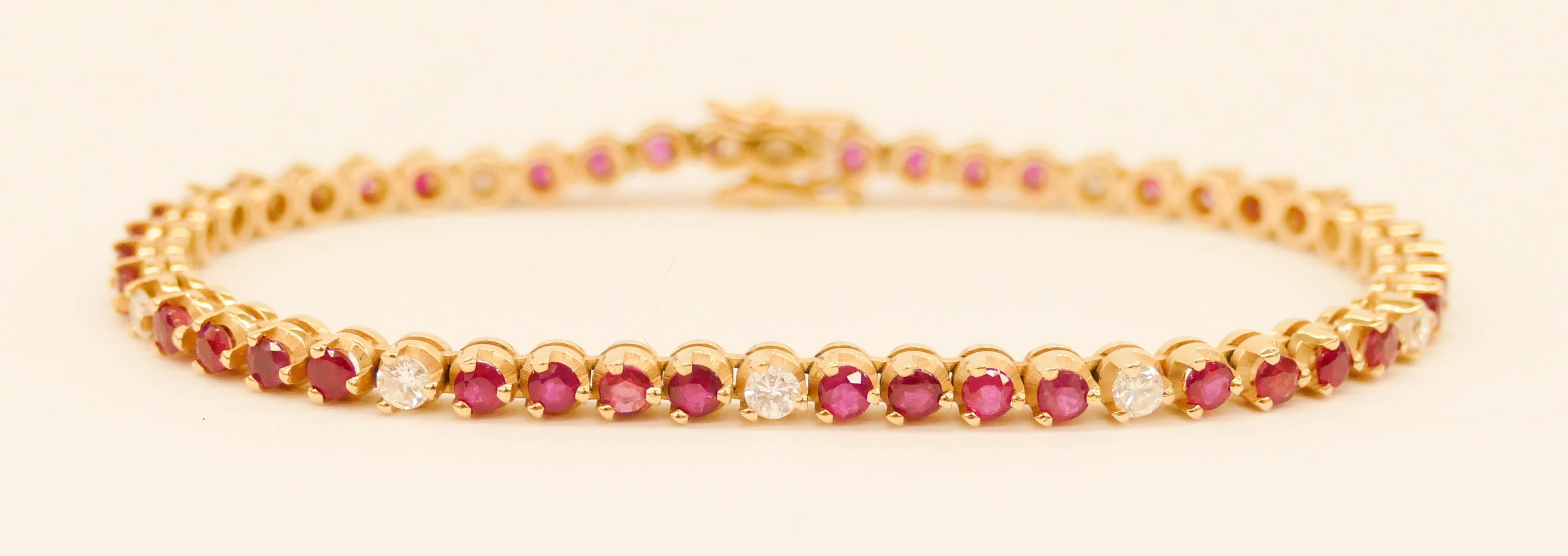 Appraisal: Lady's Diamond Ruby k Tennis Bracelet '' Straight line mm