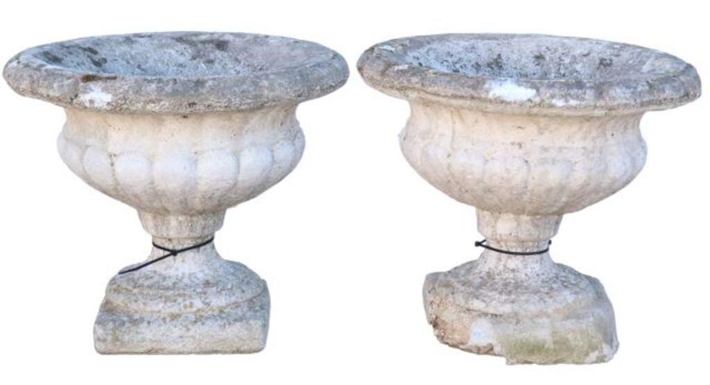 Appraisal: pair Cast stone melon rib garden urns having flared rim