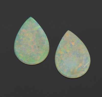 Appraisal: A Matched Pair of Unmounted White Opal Cabochons Carat Total