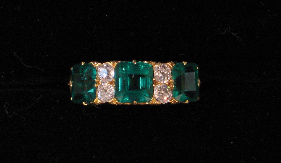 Appraisal: A VICTORIAN EMERALD AND DIAMOND DRESS RING the central square-cut