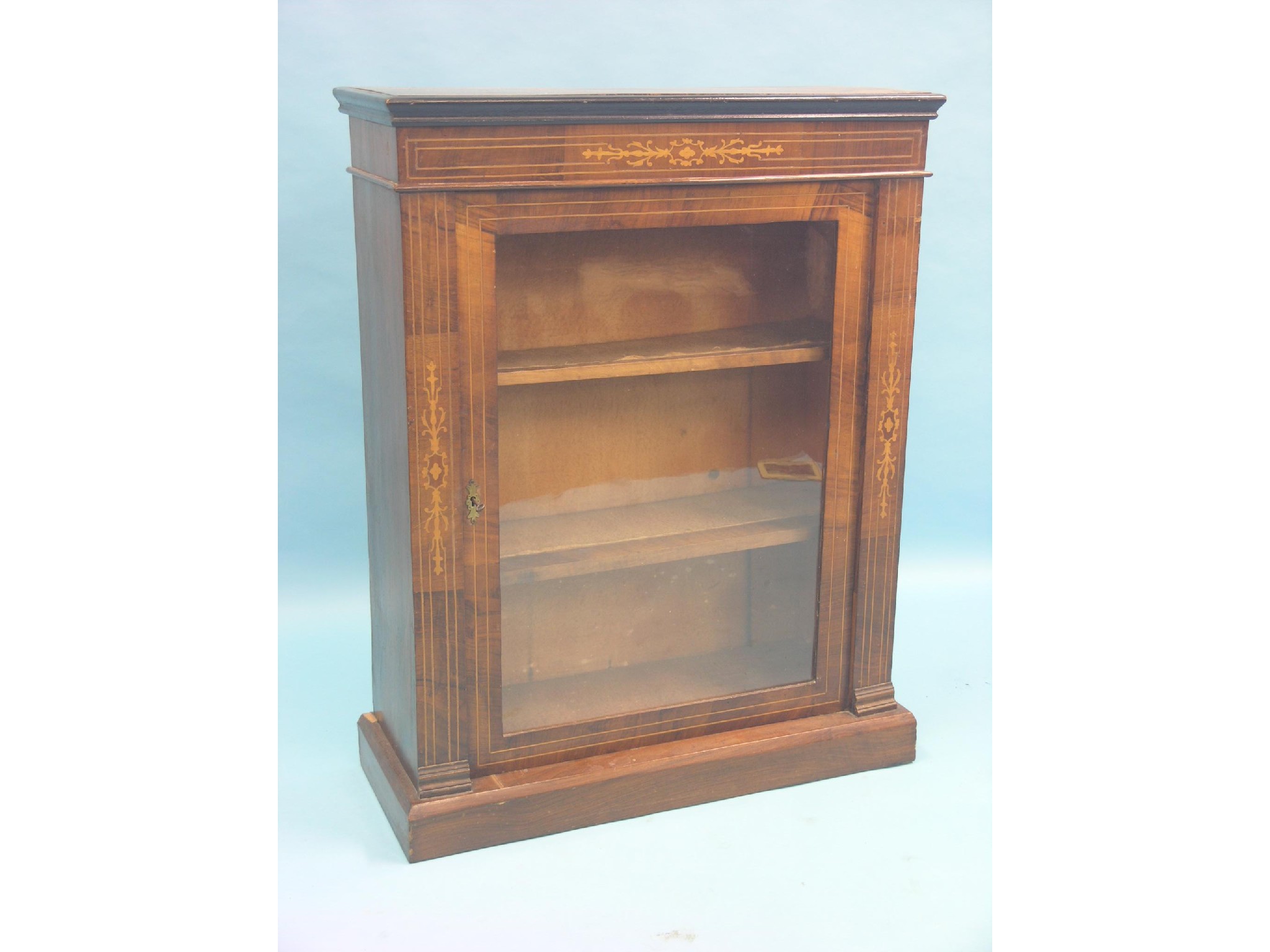 Appraisal: A Victorian inlaid walnut display cabinet single glazed door enclosing