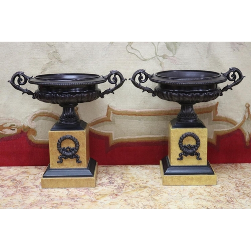 Appraisal: Pair of faux marble and bronze twin handled urns each