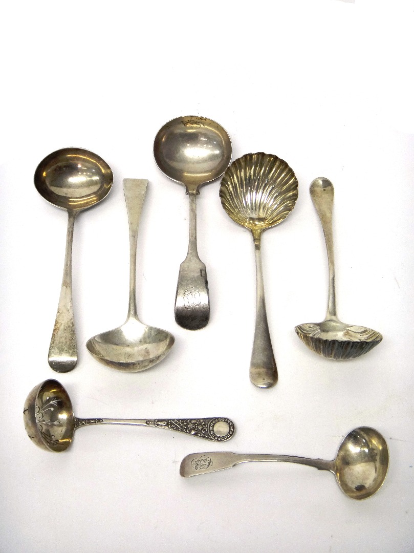 Appraisal: A pair of George III Old English pattern sauce ladles