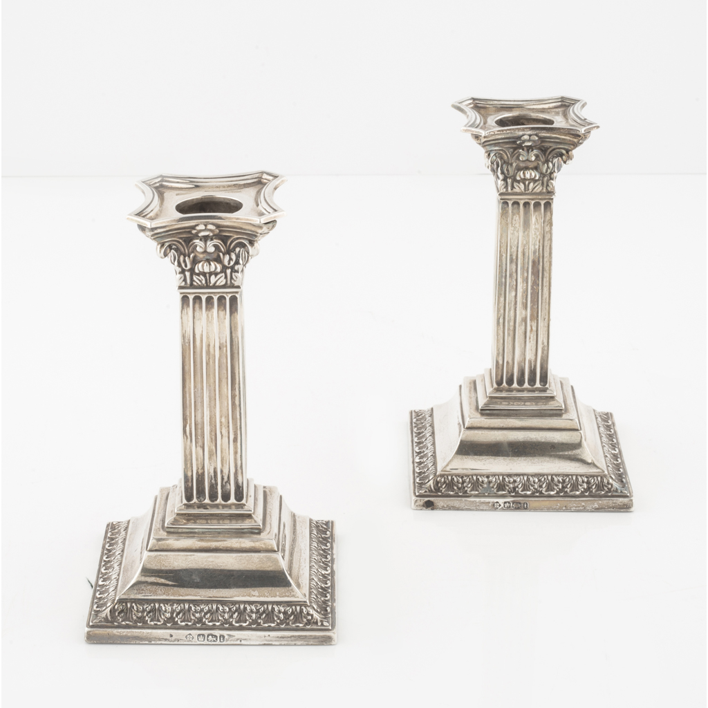 Appraisal: A pair of dwarf candlesticks Martin Hall and Co Sheffield