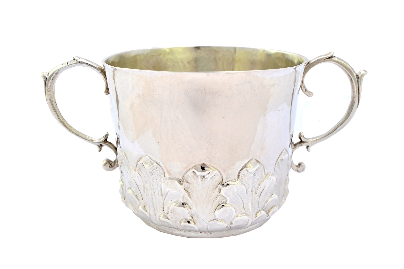 Appraisal: A Charles II silver twin handled porringer chased with a