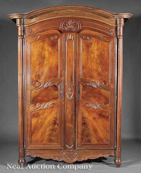 Appraisal: A Louis XVI-Style Carved Walnut Armoire th c arched cornice