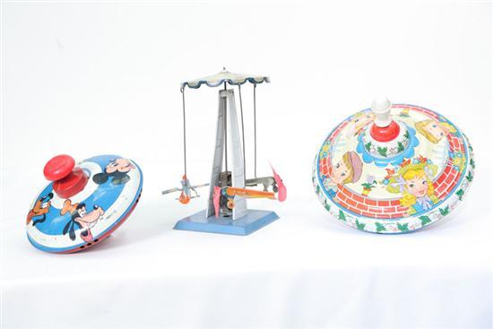 Appraisal: THREE TIN WIND UP TOYS Two tops one by the